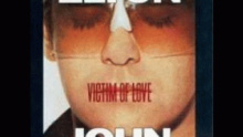 Смотреть клип Warm Love In A Cold World - Elton John